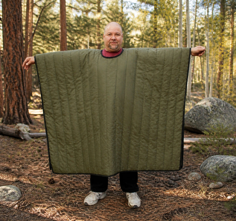 Load image into Gallery viewer, Man standing in the woods with Wiggy's Poncho with a Head hole Color Olive
