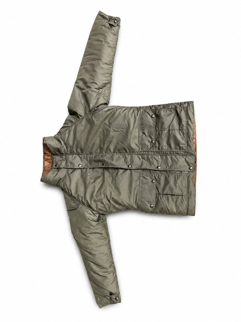 Load image into Gallery viewer, An olive green puffer jacket with a brown lining, laid flat on a white background.
